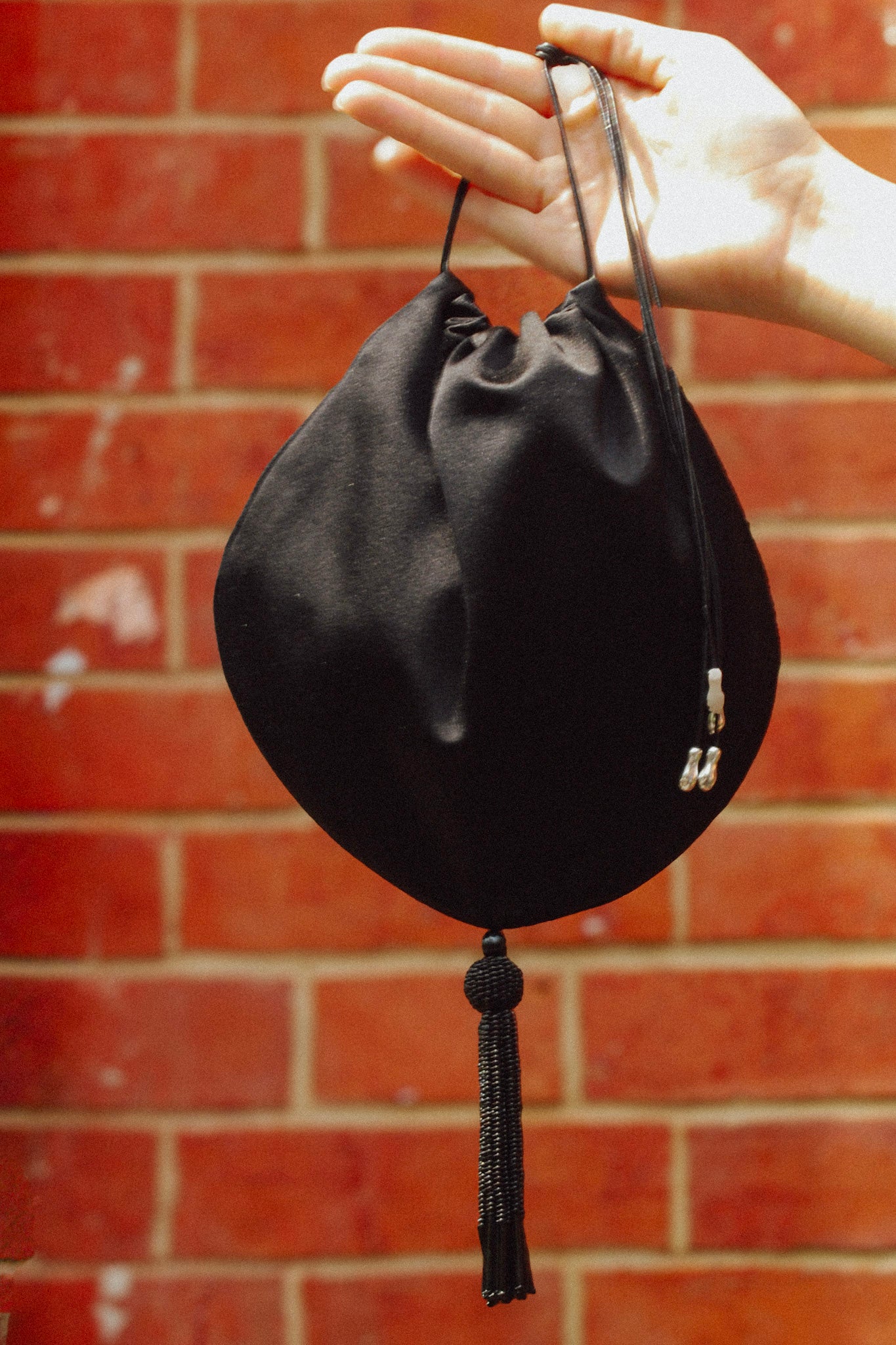 Beaded Tassel Pochette in Black